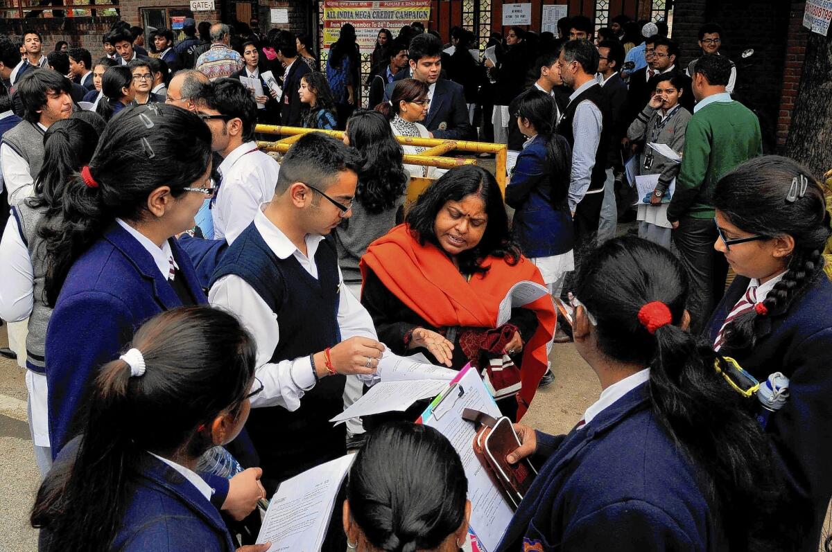 High school students gather after taking a national exam in Noida, India, last month. So-called board exams for 10th- and 12th-graders determine admission to the best universities and job-training programs.
