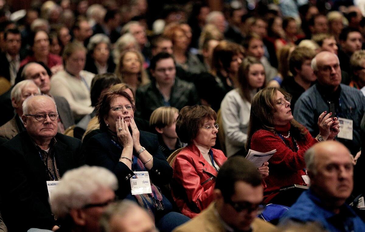 Kitty Nalewaik, of Knoxville, Md., second from left, reacts while listening to former U.S. Sen. Jim DeMint during the Conservative Political Action Conference outside Washington, D.C.