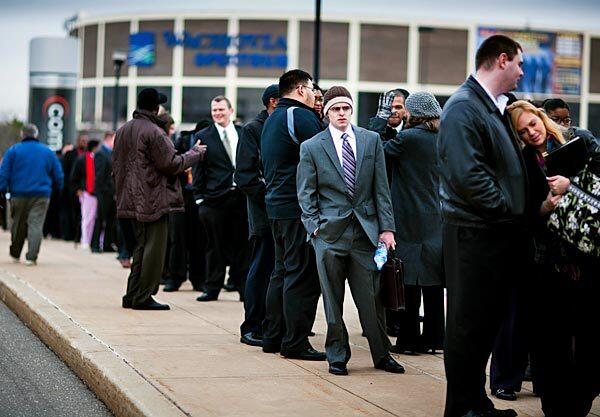 Rob McCabe stands in line before the doors open at a job fair at the Wachovia Center. The public relations major was one of almost 6,400 who attended the event.