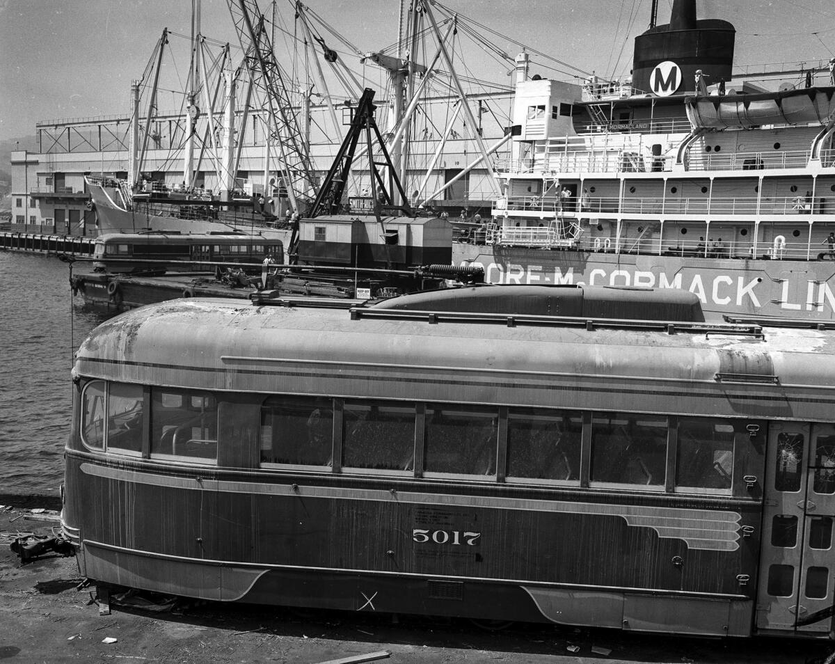 Sep. 6, 1959: Old Pacific Electric streetcars sit at Berth 232 on Terminal Island waiting to be loaded aboard Moore-McCormack Lines' Mormacland for shipment to Buenos Aires.