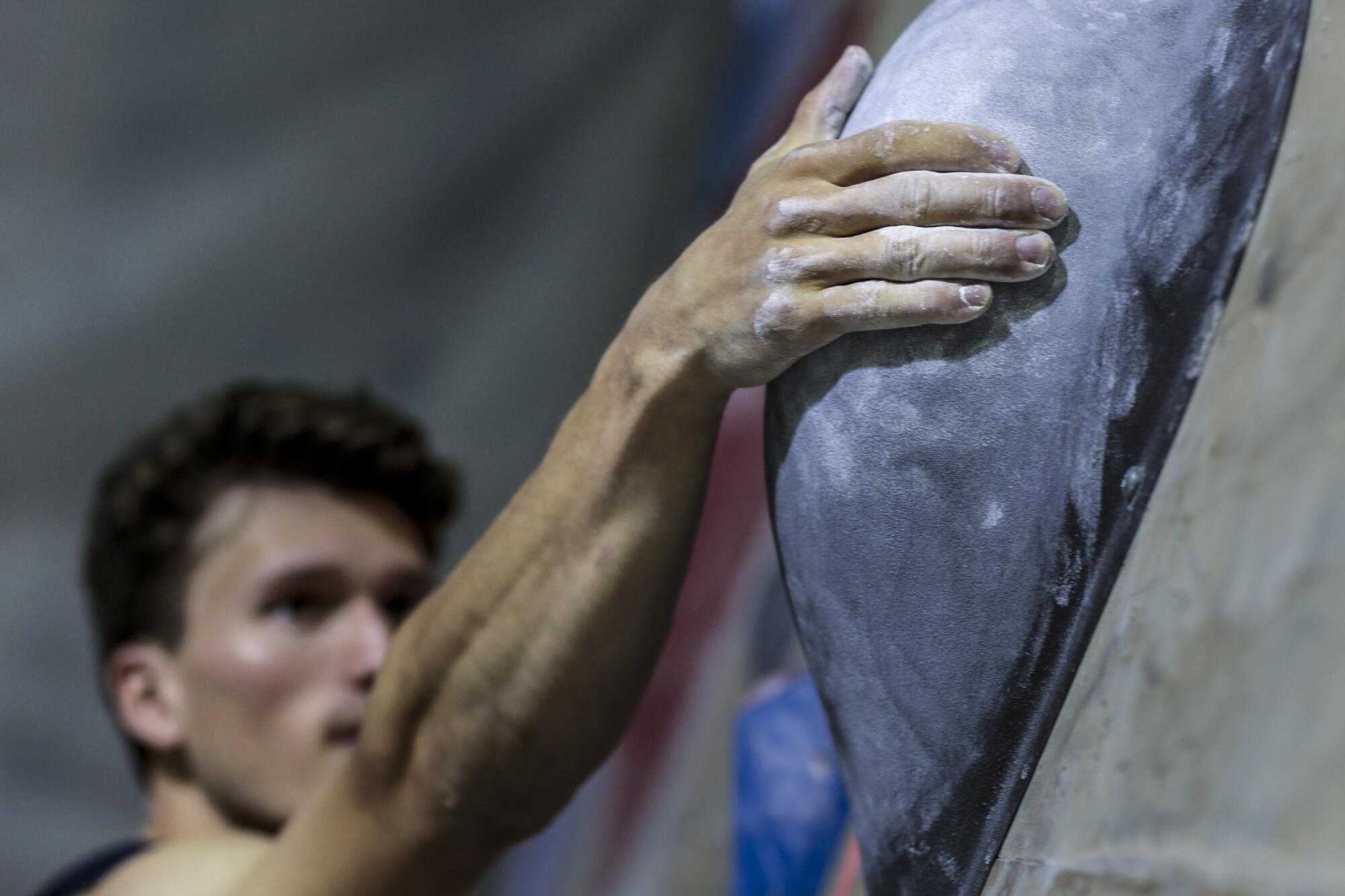 U.S. sport climber Nathaniel Coleman climbs a wall at Industry SLC in Salt Lake City.