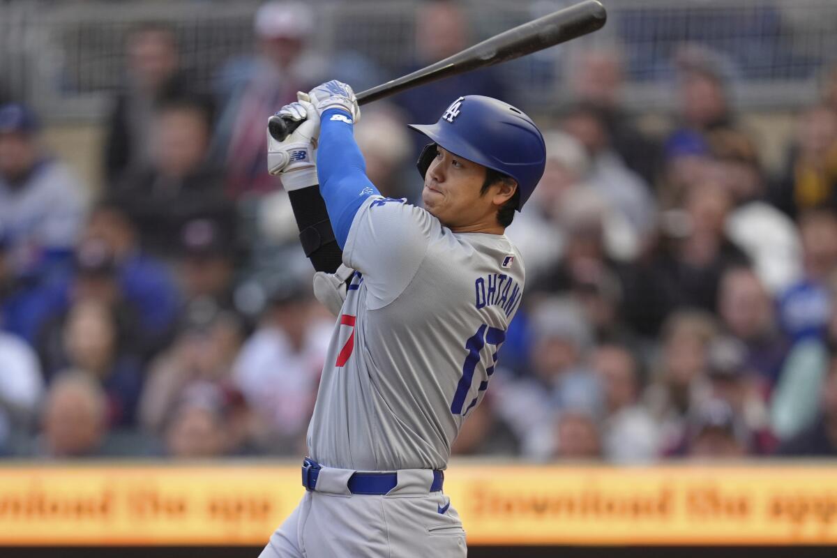 Dodgers star Shohei Ohtani hits a double against the Minnesota Twins on Monday.