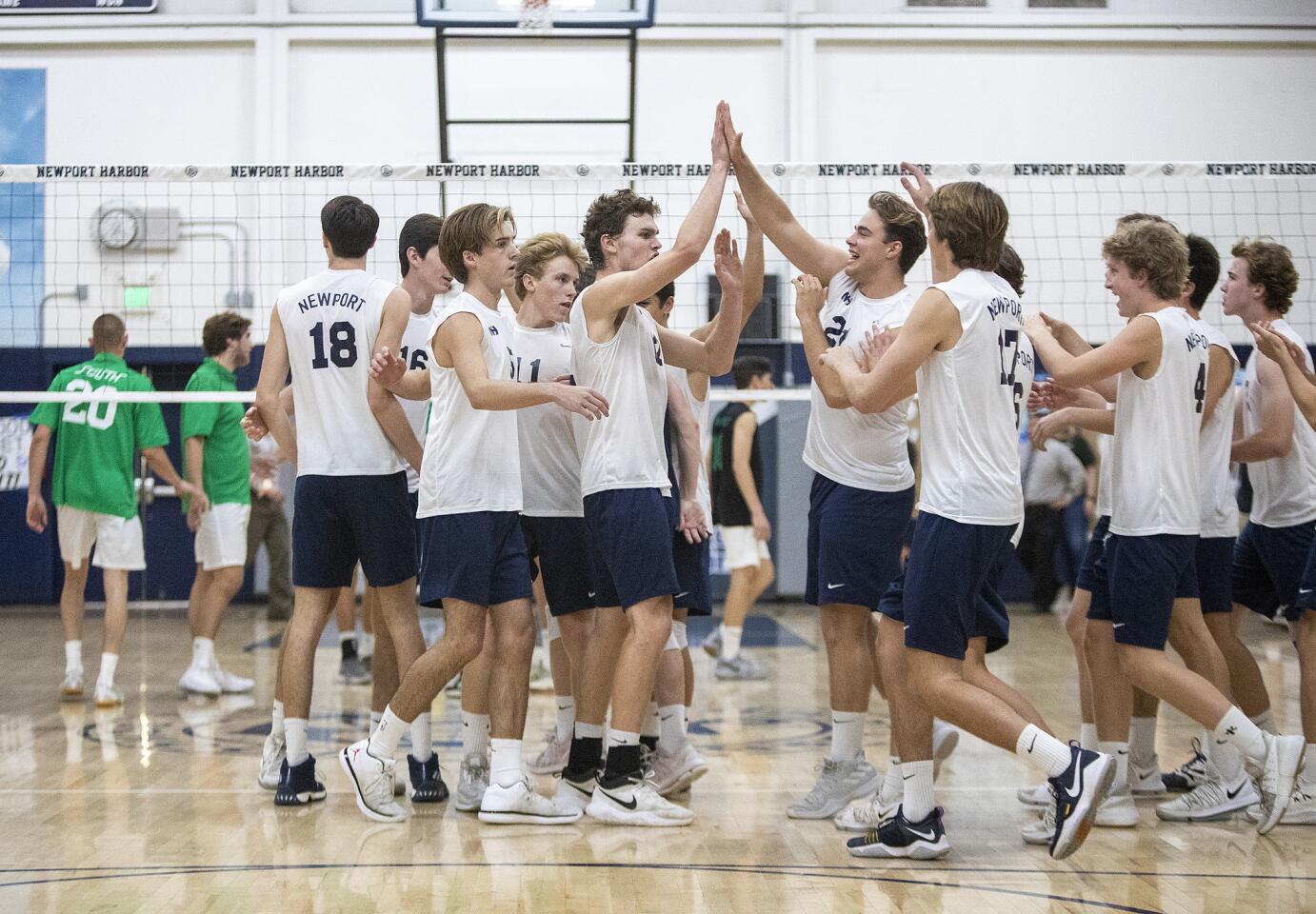 Newport Harbor celebrates sweeping South Torrance 3-0 in the semifinals of the CIF Southern Section Division 1 playoffs on Wednesday, May 16.