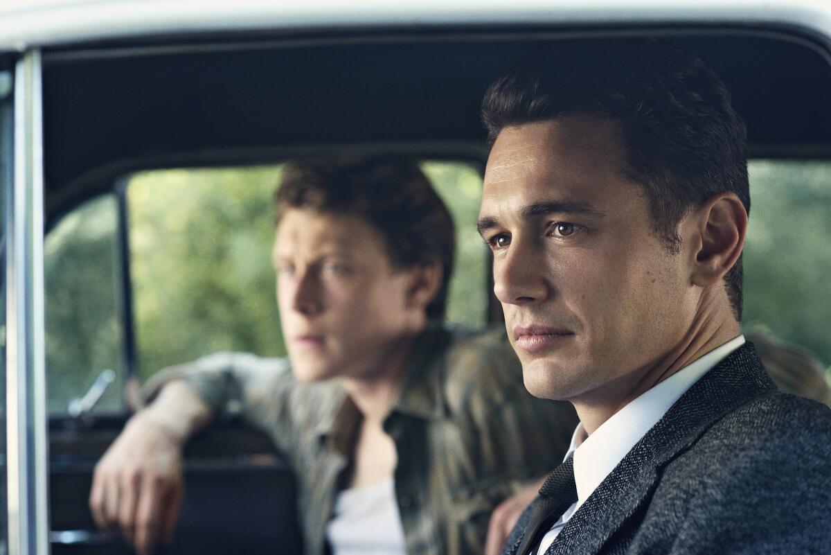 This image released by Hulu shows James Franco as Jake Epping, right, and George MacKay as Bill Turcotte in a scene from the eight-part series, "11.22.63," streaming on Hulu beginning Monday, Feb. 15, 2016.