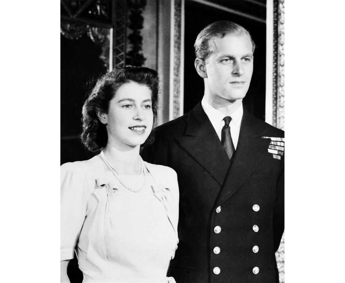 Sep. 17, 1947: Princess Elizabeth and Royal Navy Lt. Philip Mountbatten pose in the White Drawing Room of Buckingham Palace.