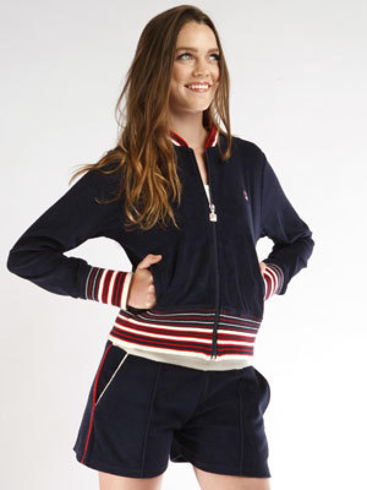 Terry warmup jacket in navy, $90, and short-shorts, $58, with red and white trim.