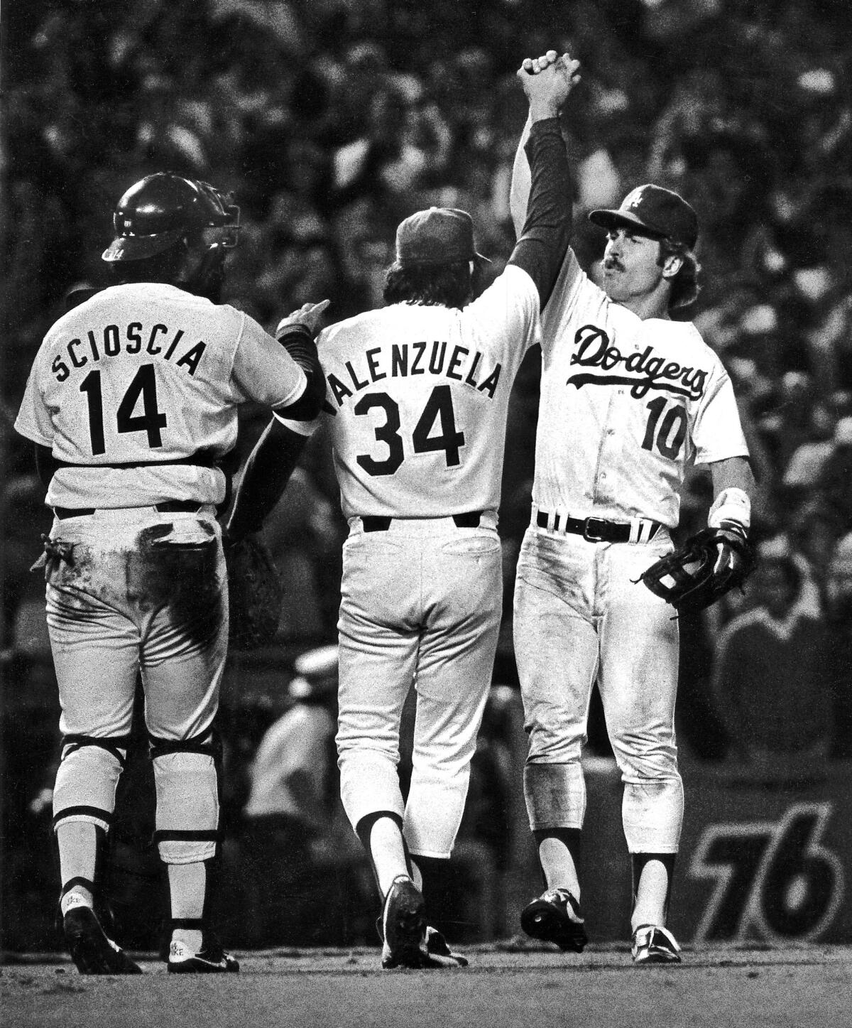 Dodgers' Fernando Valenzuela and Ron Cey celebrate after Game 3 of the World Series against the Yankees on Oct. 23, 1981.