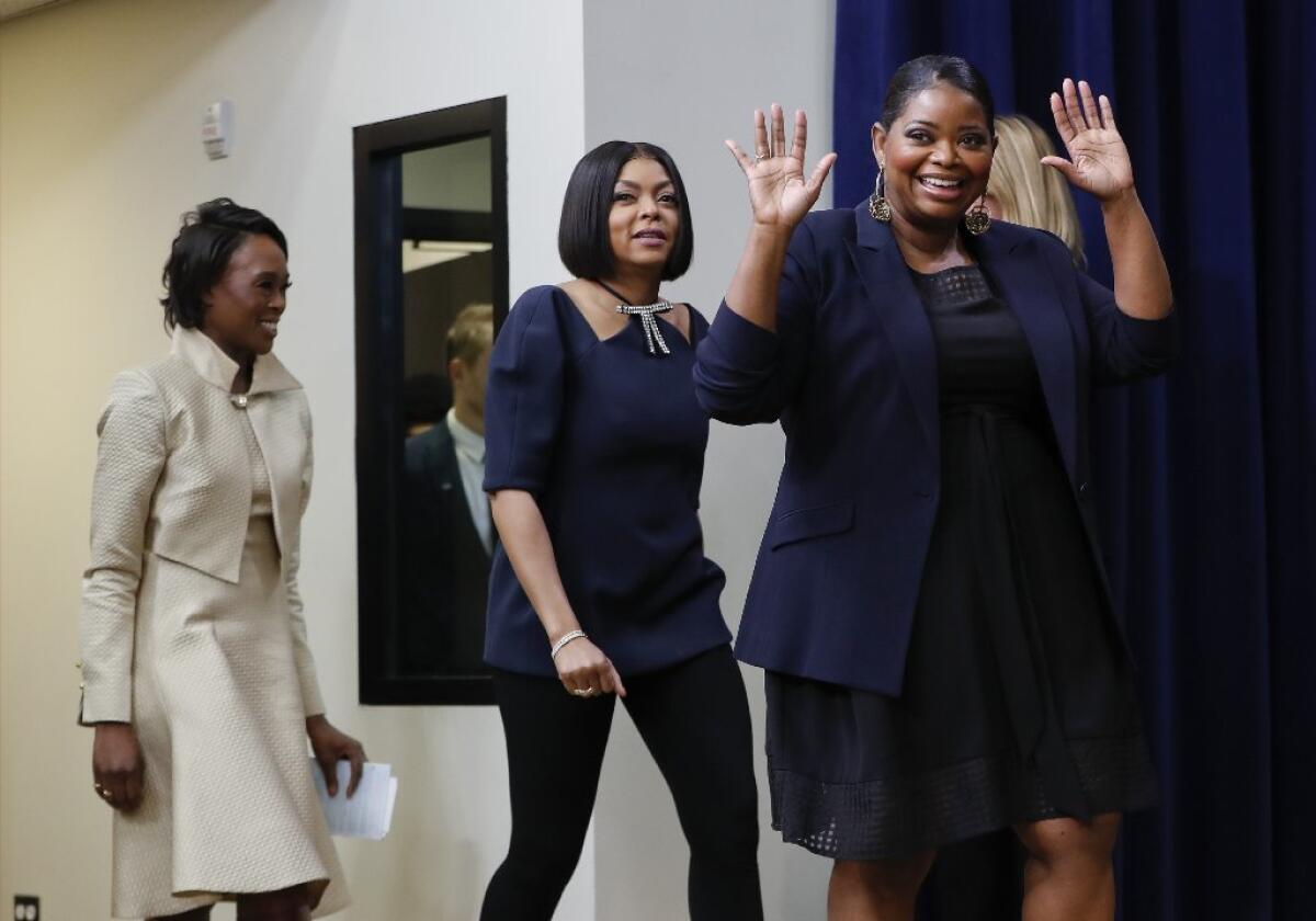 Author Margot Lee Shetterly, left, actresses Taraji P. Henson and Octavia Spencer are introduced after the White House screening for "Hidden Figures."