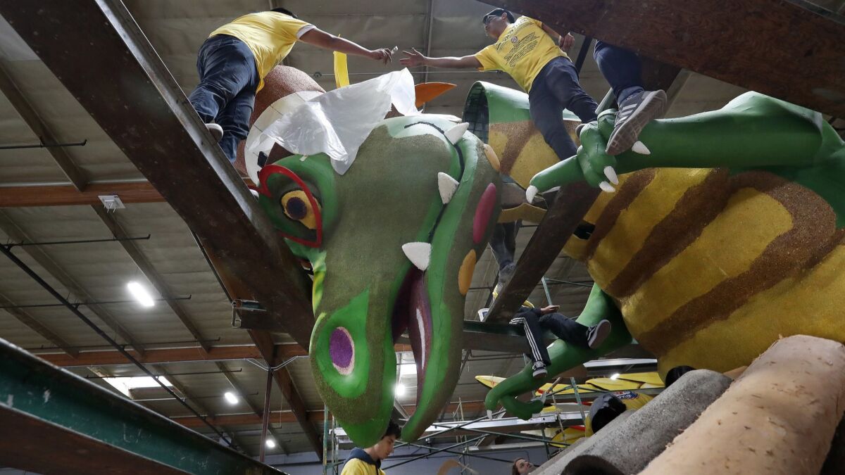 Workers this week in Irwindale prepare a Rose Parade float for Rotary International that will debut on Tuesday in the 2019 Rose Parade in Pasadena on New Year's Day. A carriage fee dispute threatens KTLA-TV Channel 5's Rose Parade coverage for Spectrum customers.