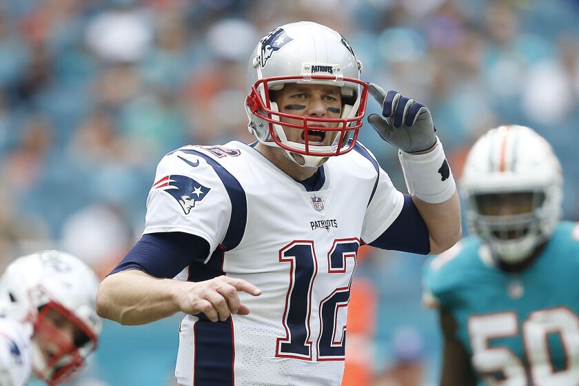 MIAMI, FL - DECEMBER 09: Tom Brady #12 of the New England Patriots throws a pass against the Miami Dolphins at Hard Rock Stadium on December 9, 2018 in Miami, Florida. (Photo by Michael Reaves/Getty Images)