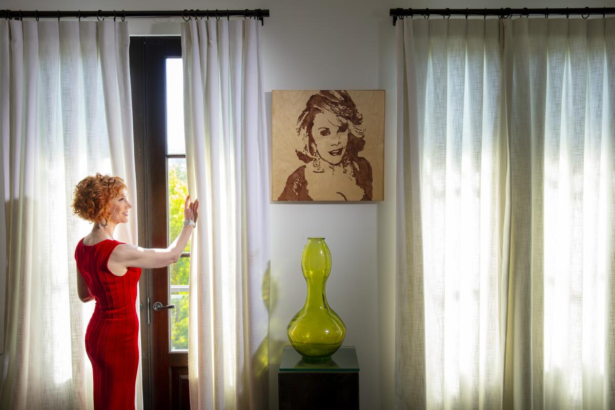 Kathy Griffin is photographed in her office with artwork of Joan Rivers.