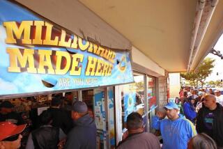 A crowd lines up to buy Powerball lottery tickets at Bluebird Liquor in Hawthorne recently.