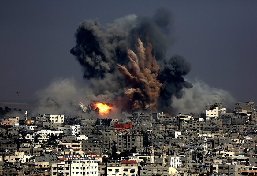 Smoke rises from Tuffah neighborhood after Israeli air strikes in the east of Gaza City.