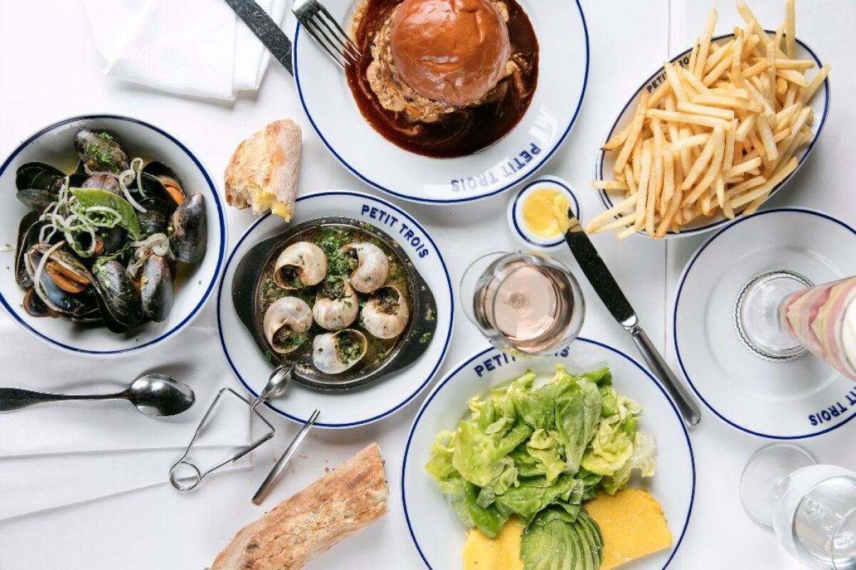 Popular dishes at Petit Trois Valley include mussels marinière, the Big Mec double cheeseburger, avocado-feta omelet and escargots.
