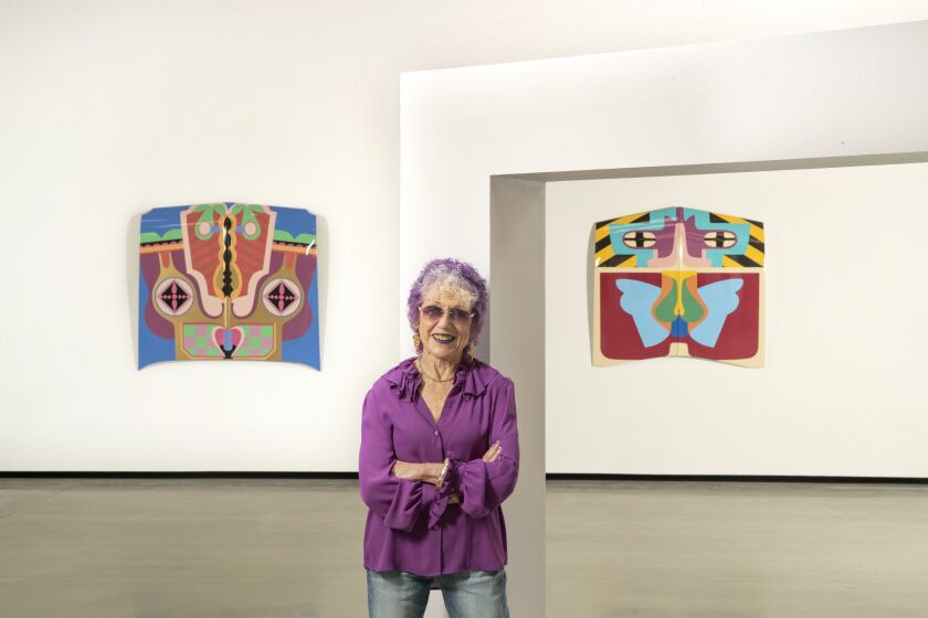 HOLLYWOOD, CA-AUGUST 30, 2019: Artist Judy Chicago is photographed in front of pieces titled, Birth Hood, 1965, remade in 2011, sprayed automatic lacquer on car hood, and Flight Hood, right, 1965, remade in 2011, sprayed automatic lacquer on car hood, on display at Deitch gallery in Hollywood. Deitch gallery in Hollywood is showing ChicagoÕs early works, produced in L.A. and Fresno between 1965-72. (Mel Melcon/Los Angeles Times)