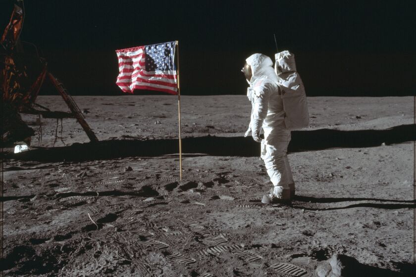 FILE - In this July 20, 1969 photo made available by NASA, astronaut Buzz Aldrin Jr. poses for a photograph beside the U.S. flag on the moon during the Apollo 11 mission. Aldrin and fellow astronaut Neil Armstrong were the first men to walk on the lunar surface with temperatures ranging from 243 degrees above to 279 degrees below zero. Astronaut Michael Collins flew the command module. (Neil Armstrong/NASA via AP, File)