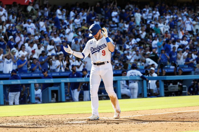 Dodgers second base Gavin Lux reacts as he crosses the plate after hitting a solo home run against the Boston Red Sox 