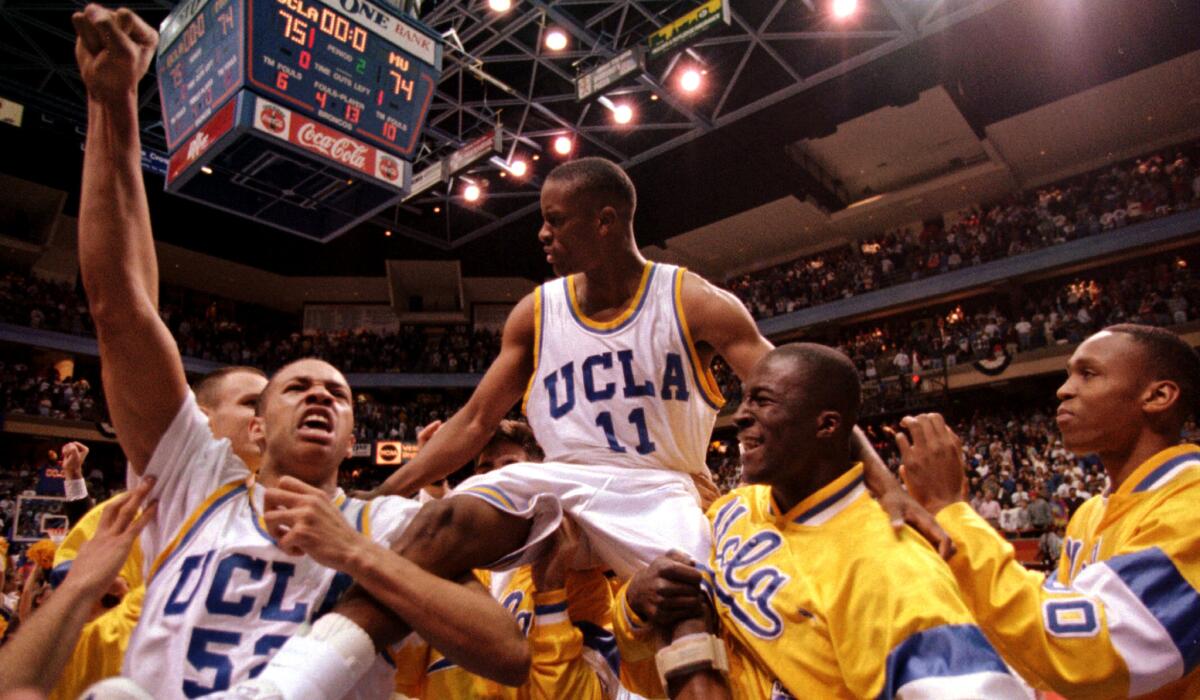 Tyus Edney is carried on his teammates' shoulders.