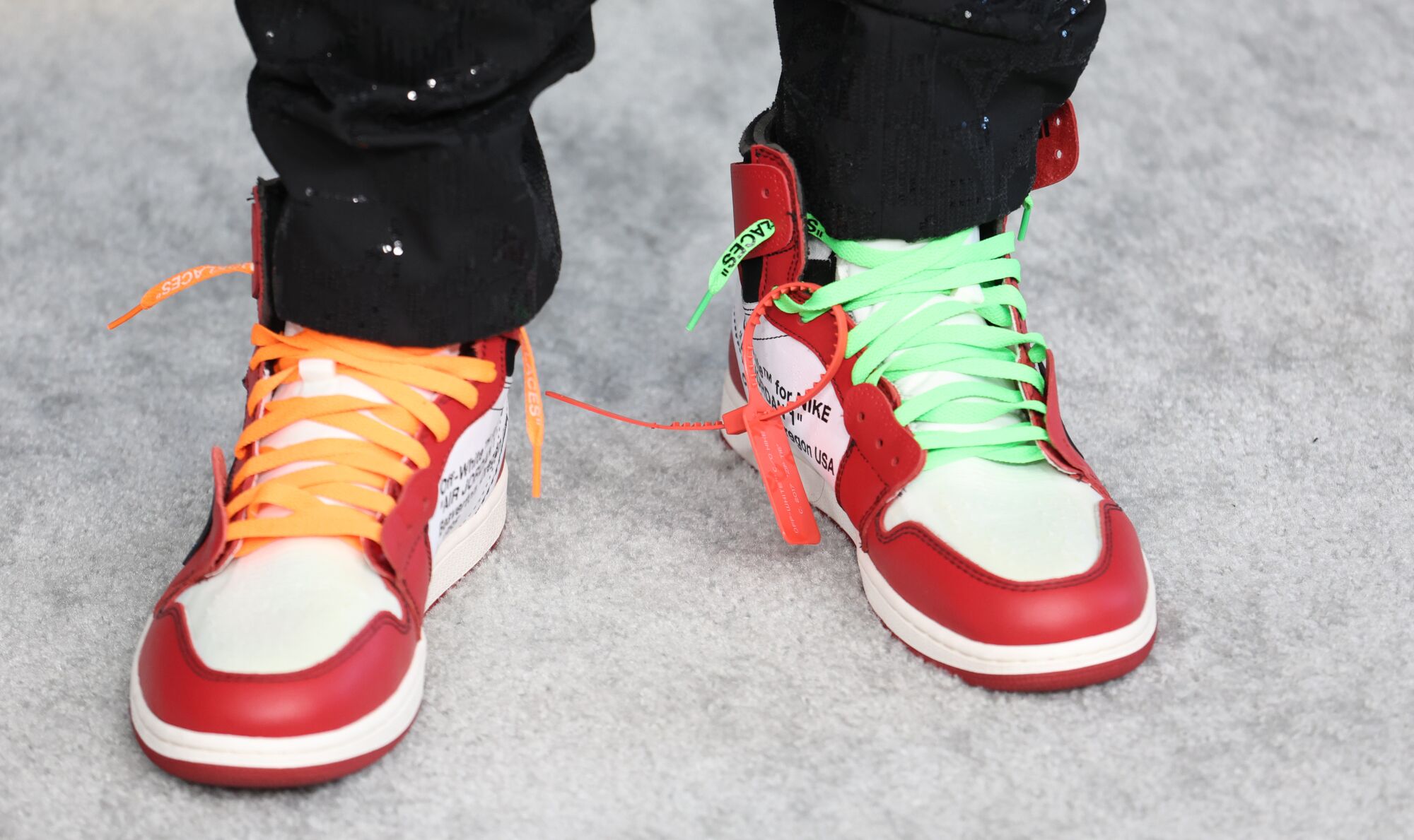 Kid Cudi footwear on the silver carpet.