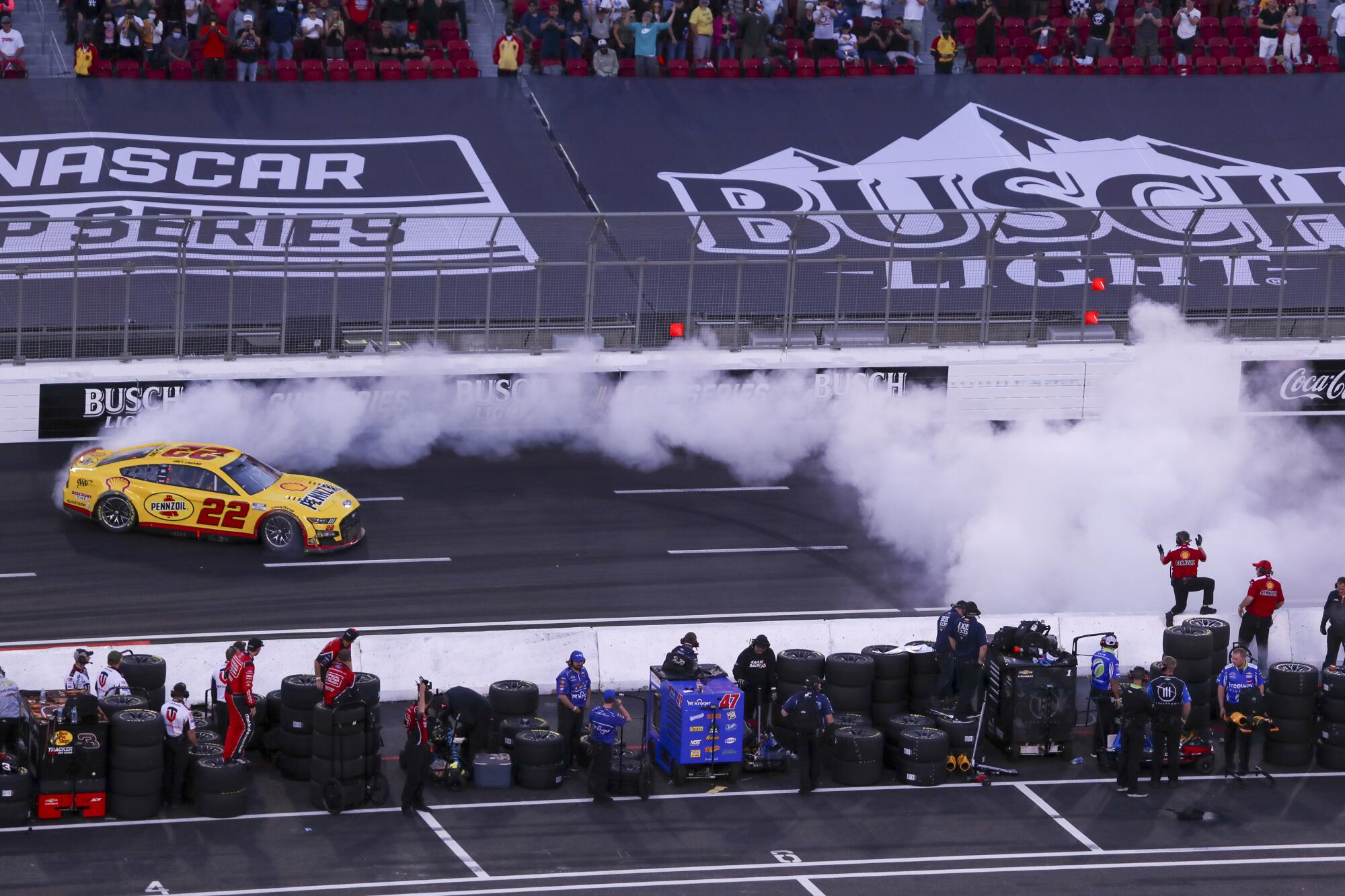 NASCAR driver Joey Logano, #22, does a celebratory burn-out