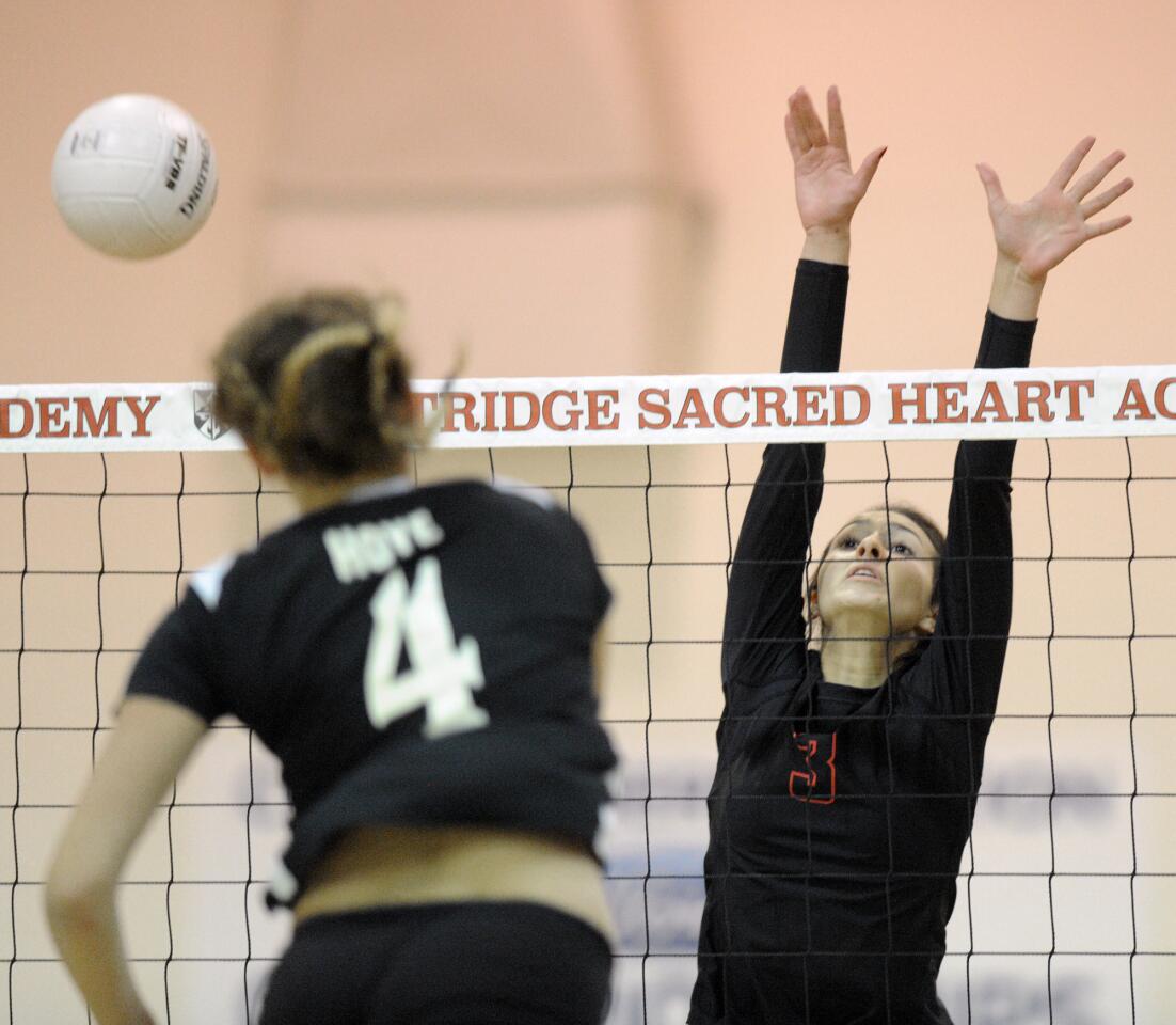Flintridge Sacred Heart Academy's Mady Martinez tries to stop a hit by San Clemente's Cali Hoye during a CIF playoff match on Tuesday, Oct. 10, 2015.