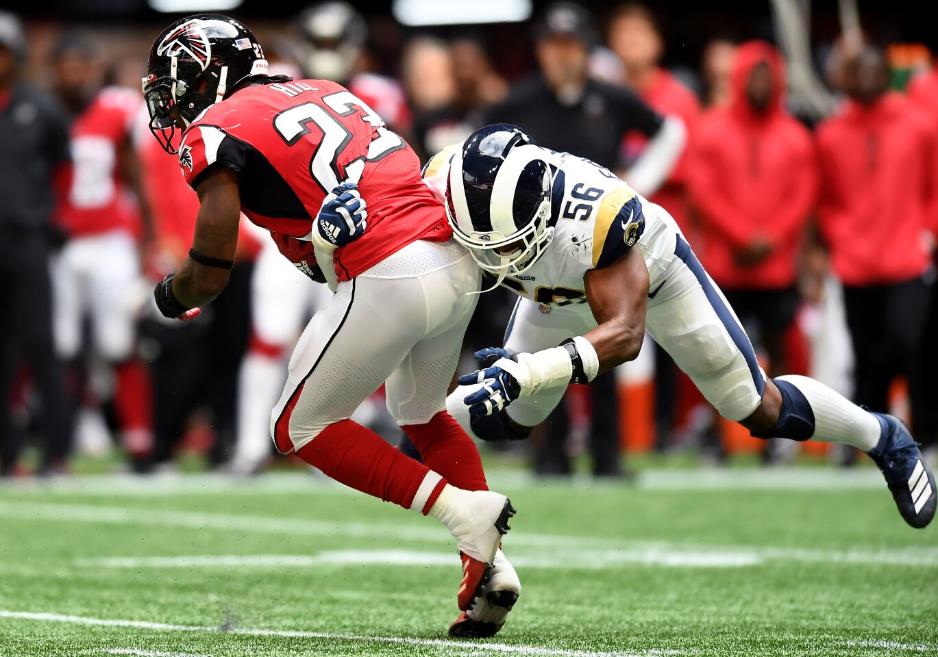 Rams linebacker Dante Fowler Jr. tackles Falcons running back Brian Hill during the fourth quarter.