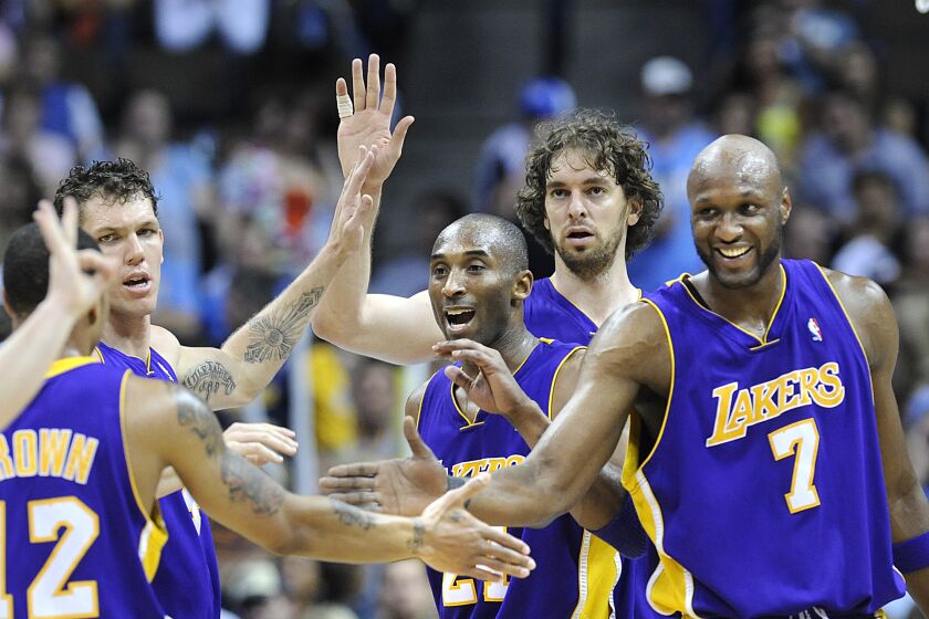 Skalij, Wally –– – DENVER, CO. MAY 29, 2009––Lakers from left, Luke Walton, Kobe Bryant, Pau Gasol and Lamar Odom celebrate with Shannon Brown who drew a foul against the Nuggets in Game 6 of the Western Conference Finals in Denver Friday.