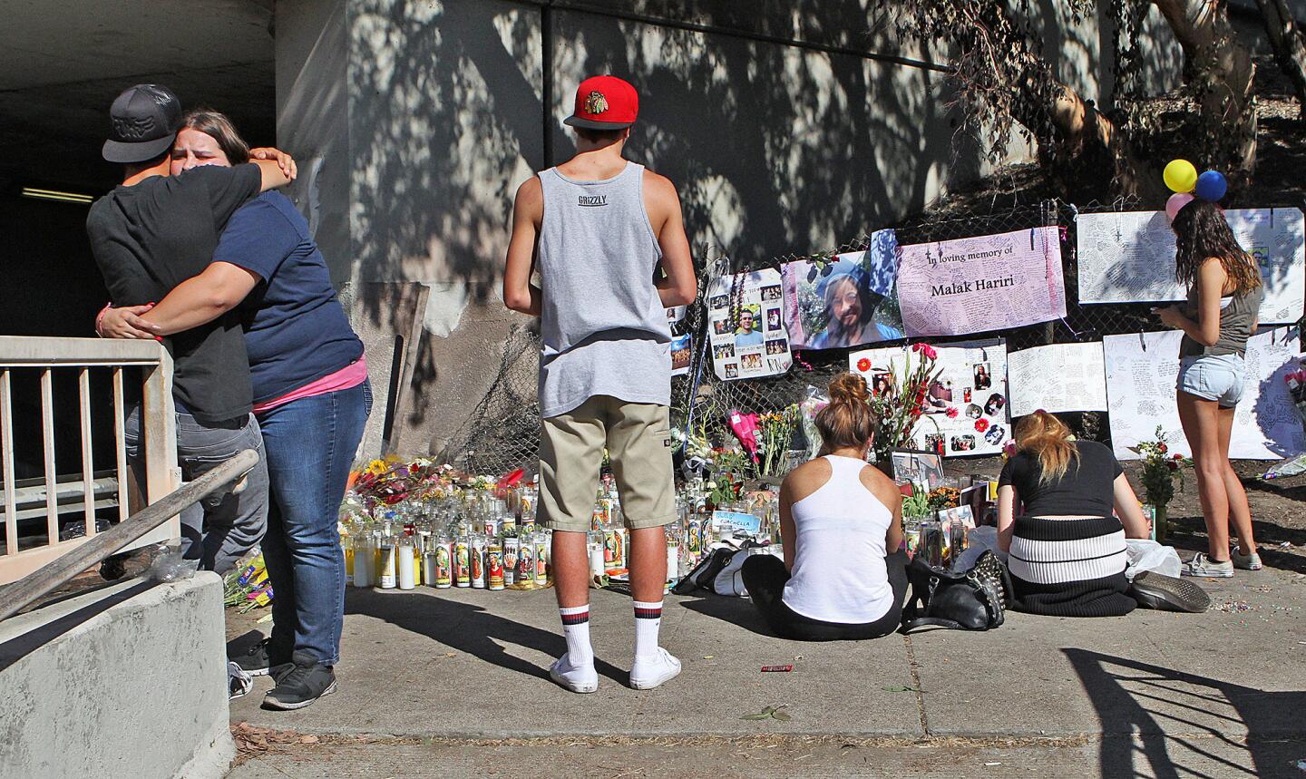 Young mourners gather at a memorial set up on San Fernando Road where it crosses under Interstate 5 in Burbank on Monday, September 30, 2013. Five Burbank youth's: Sugey Cuevas, Stephen Stoll, Malak Hariri, Sebastian Forero and Sameer Nevarez, died in a fiery car crash on San Fernando Road Saturday.