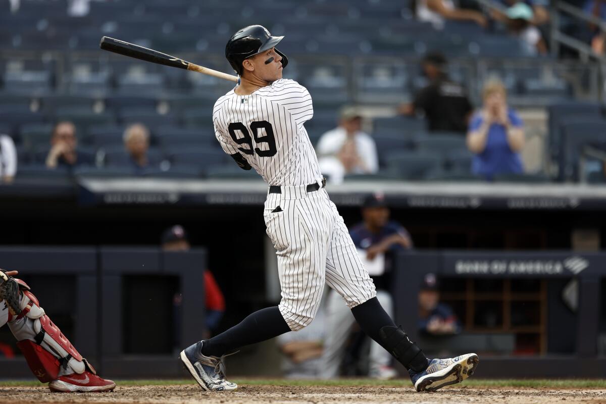 New York Yankees' Aaron Judge hits a three-run home run against the Minnesota Twins during the eighth inning of a baseball game on Monday, Sept. 13, 2021, in New York. (AP Photo/Adam Hunger)