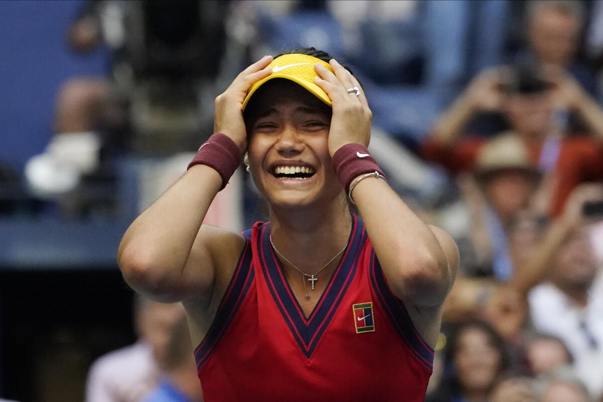 Emma Raducanu, of Britain, reacts after defeating Leylah Fernandez, of Canada.