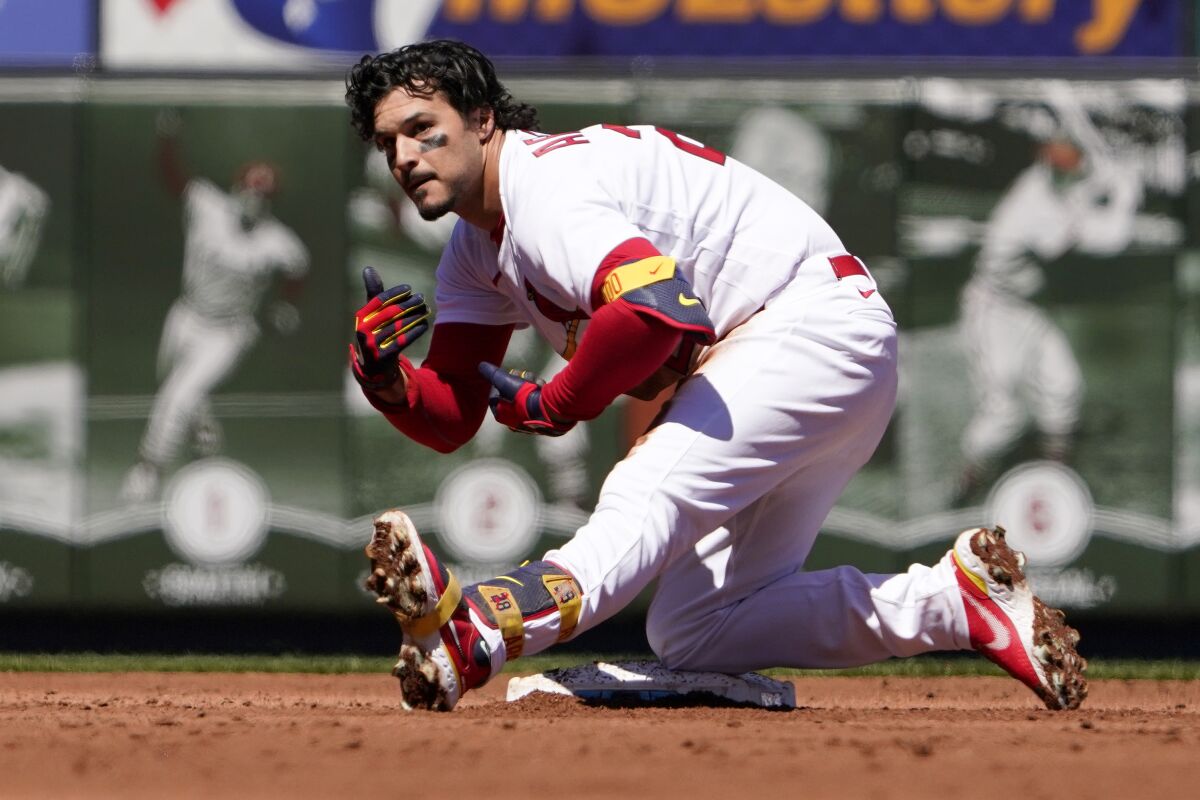 St. Louis Cardinals' Nolan Arenado celebrates after hitting an RBI double during the first inning of a baseball game against the Pittsburgh Pirates Saturday, April 9, 2022, in St. Louis. (AP Photo/Jeff Roberson)
