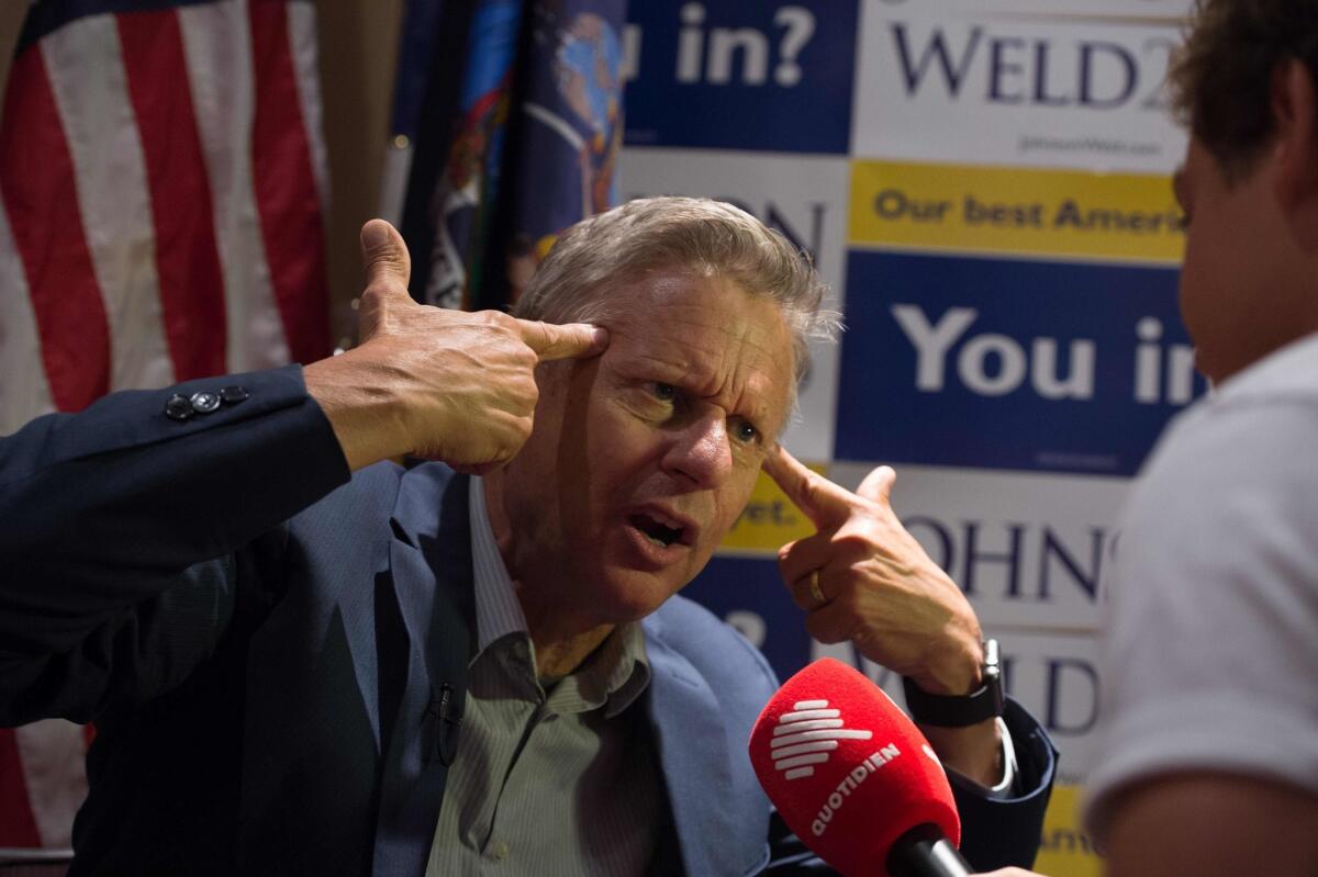 Libertarian presidential candidate Gary Johnson gestures he speaks with the media at a rally on Sept. 10, 2016, in New York.