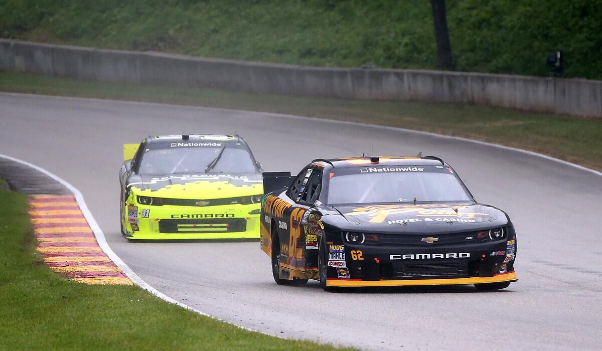 NASCAR driver Brendan Gaughan guides his No. 62 Chevrolet through some curves ahead of Justin Marks in the Nationwide Series Gardner Denver 200 at Road America in Elkhart Lake, Wis.