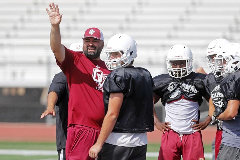 Ocean View High coach Luis Nunez instructs his players during practice on Wednesday in Huntington Beach.
