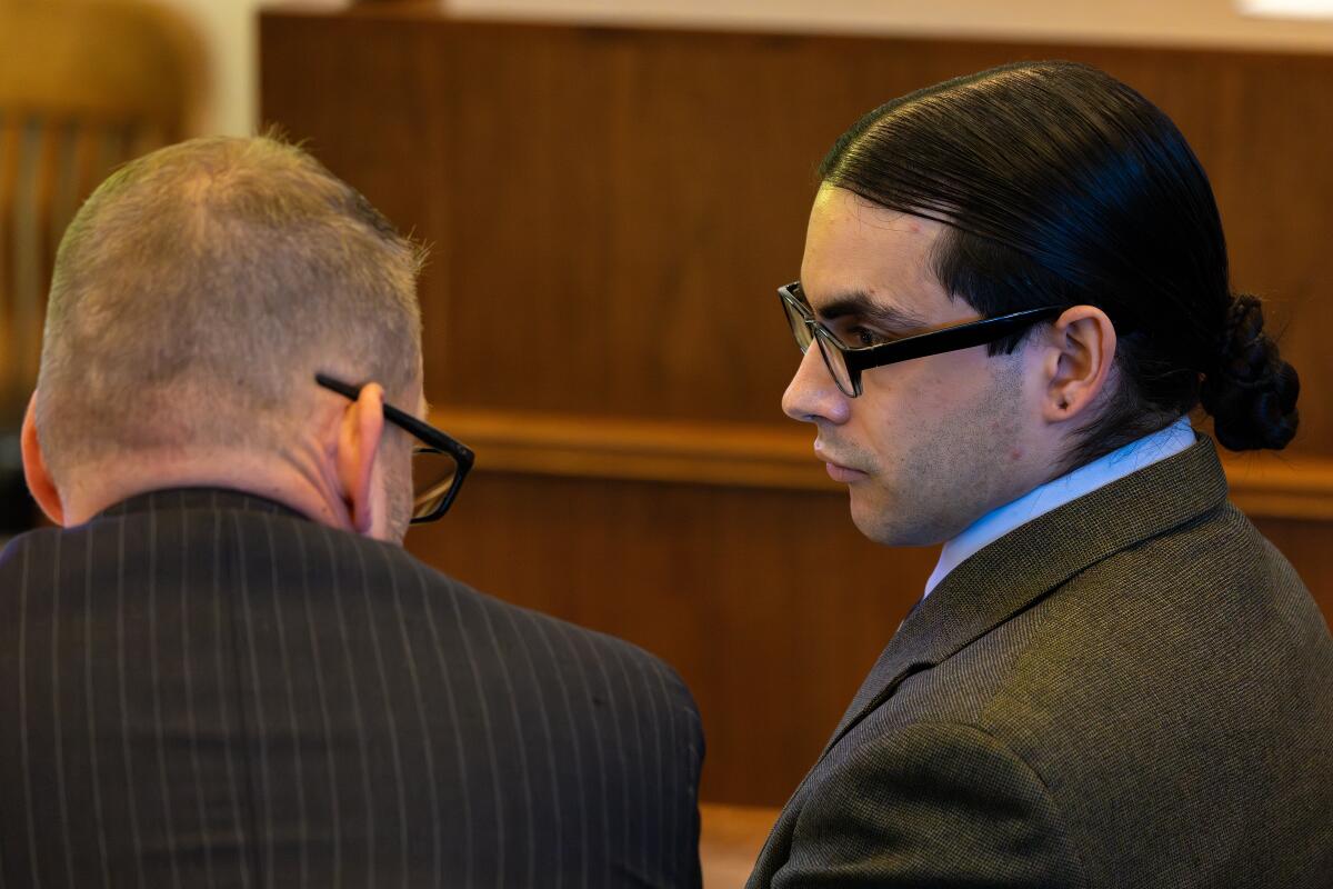Marcus Anthony Eriz, right, was found guilty of second-degree murder in the killing of Leos.