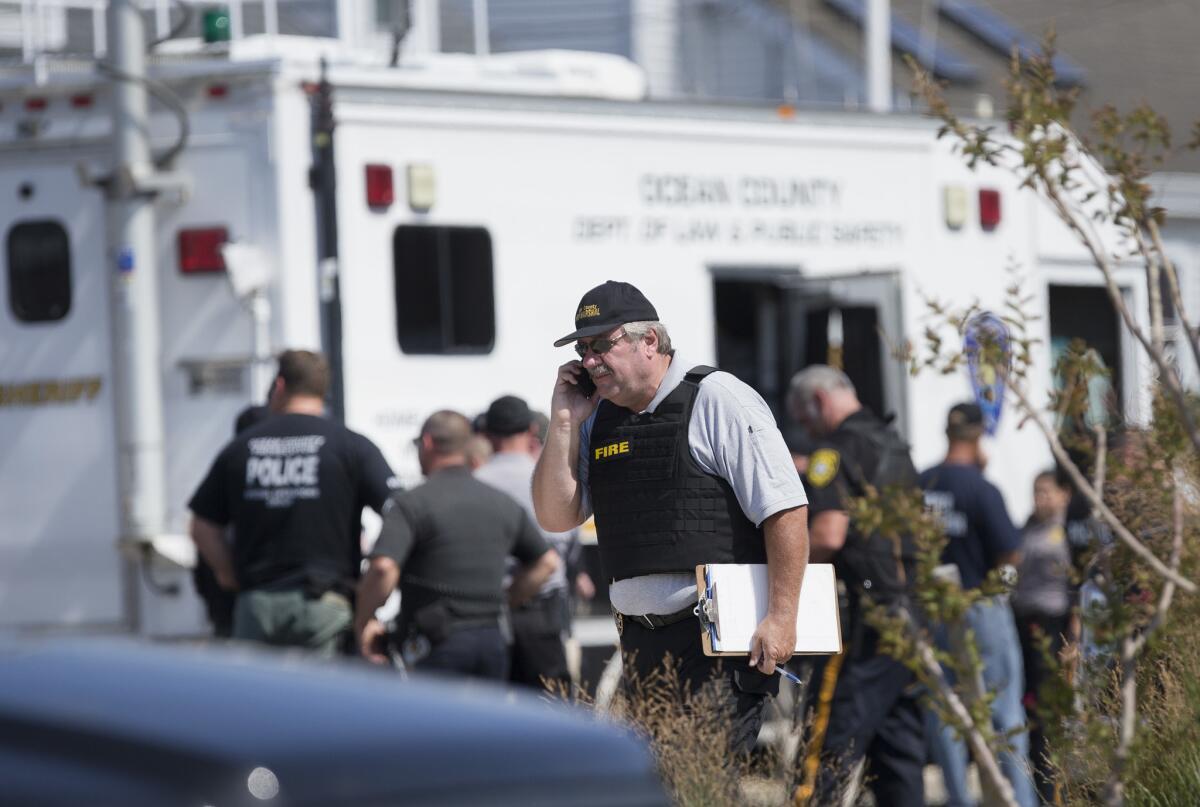 Police gather at a command center in Seaside Park, N.J. on Saturday, Sept. 17.