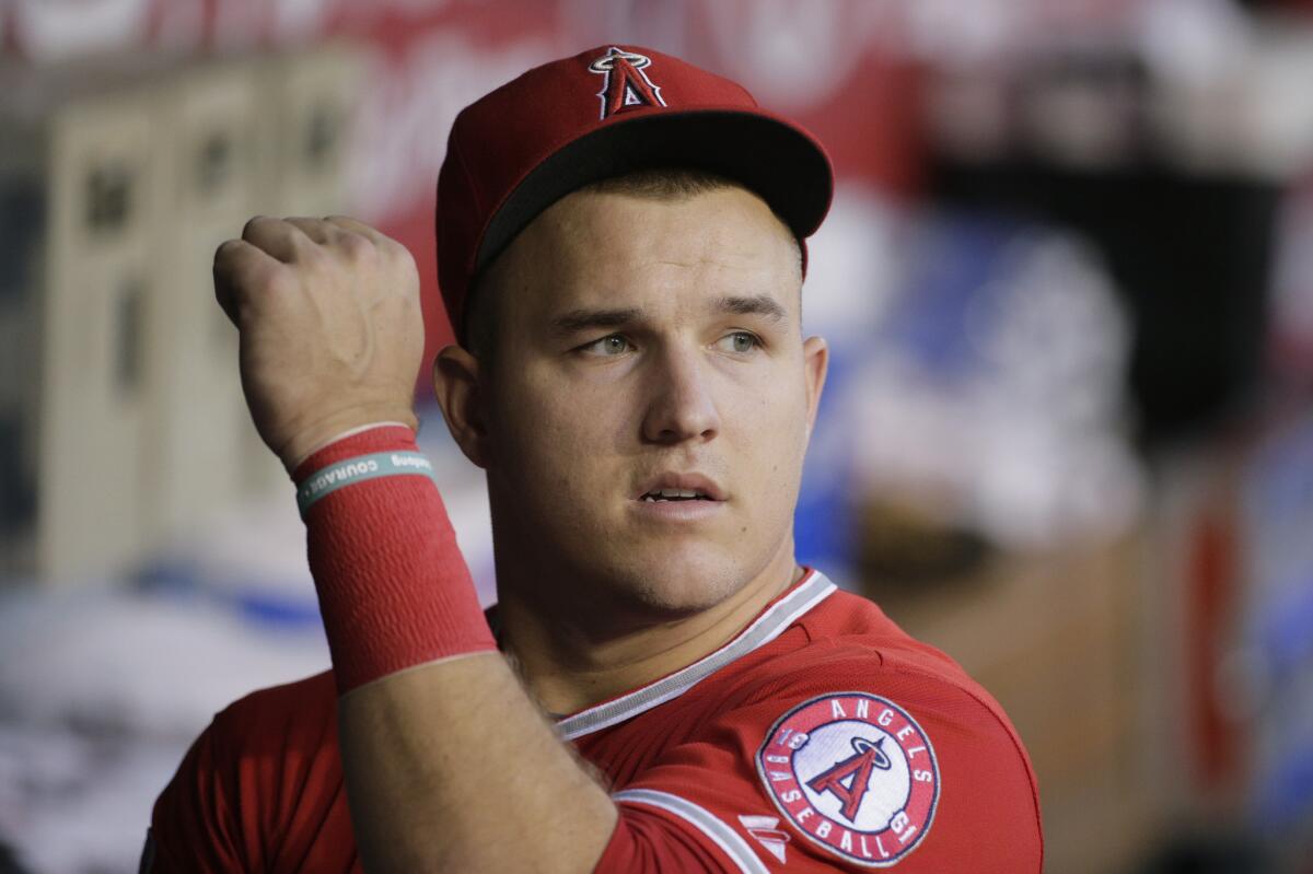 Angels outfielder Mike Trout looks on from the dugout during a game against the Texas Rangers on Sept. 4.