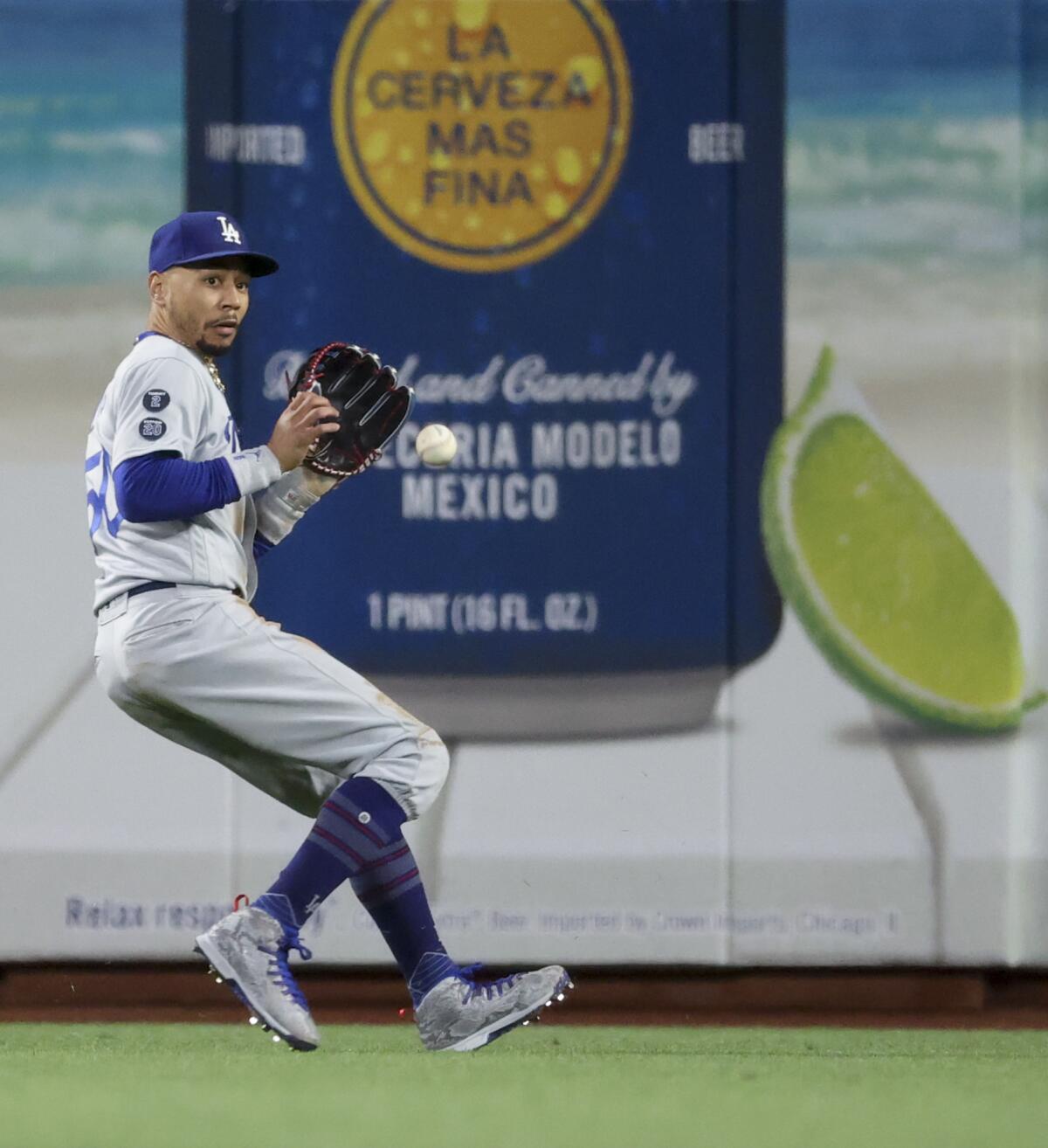 Dodgers right fielder Mookie Betts fields a ball hit by San Francisco's Brandon Crawford.