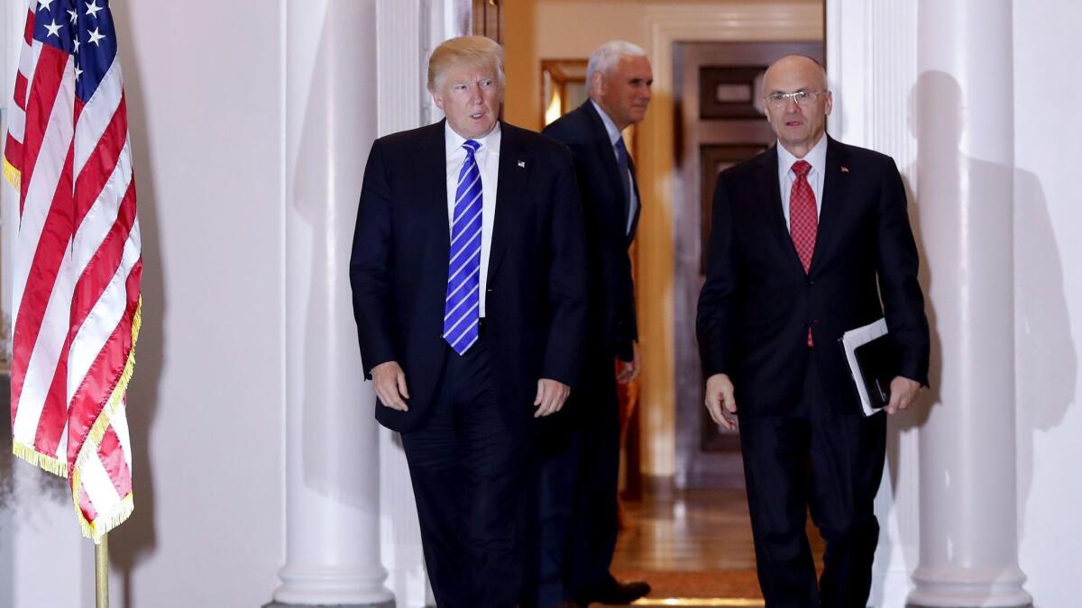 President-elect Donald Trump, left, and CKE Restaurants CEO Andy Puzder, right, at Trump National Golf Club in Bedminster, N.J., in November.