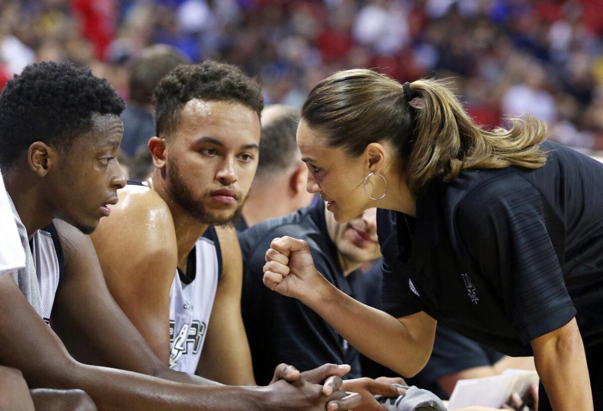 Becky Hammon talks with Cady Lalanne and Kyle Anderson during a summer league game against the New York Knicks on July 11.