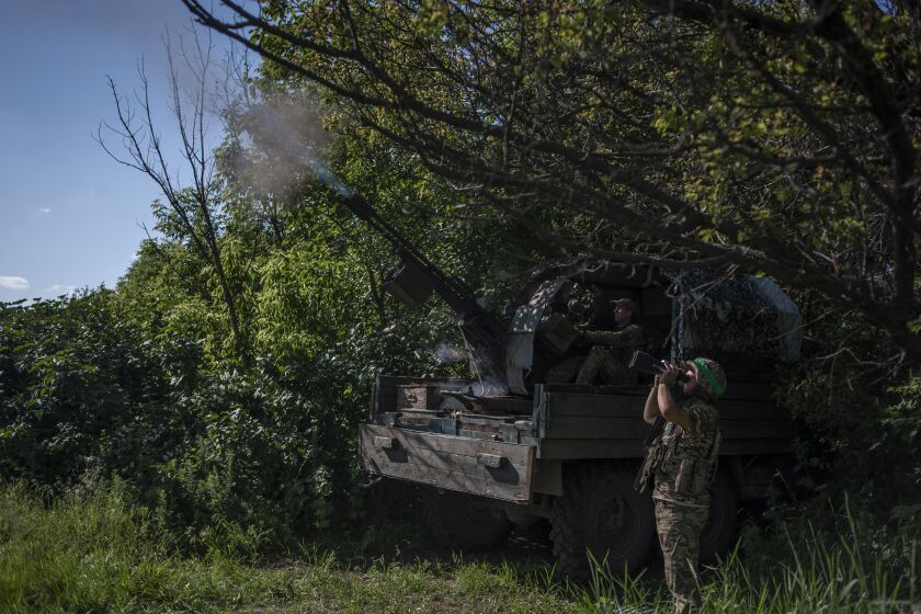 Ukrainian soldiers fire at the Russian air target on the frontline near Bakhmut, in the Donetsk region, Ukraine, Monday, June 5, 2023. (Iryna Rybakova via AP)