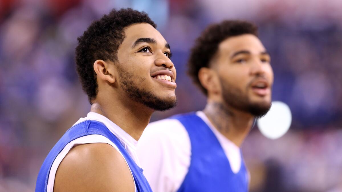 Kentucky's Karl-Anthony Towns, left, and Willie Cauley-Stein look on during an NCAA Final Four practice session at Lucas Oil Stadium in Indianapolis on April 3.