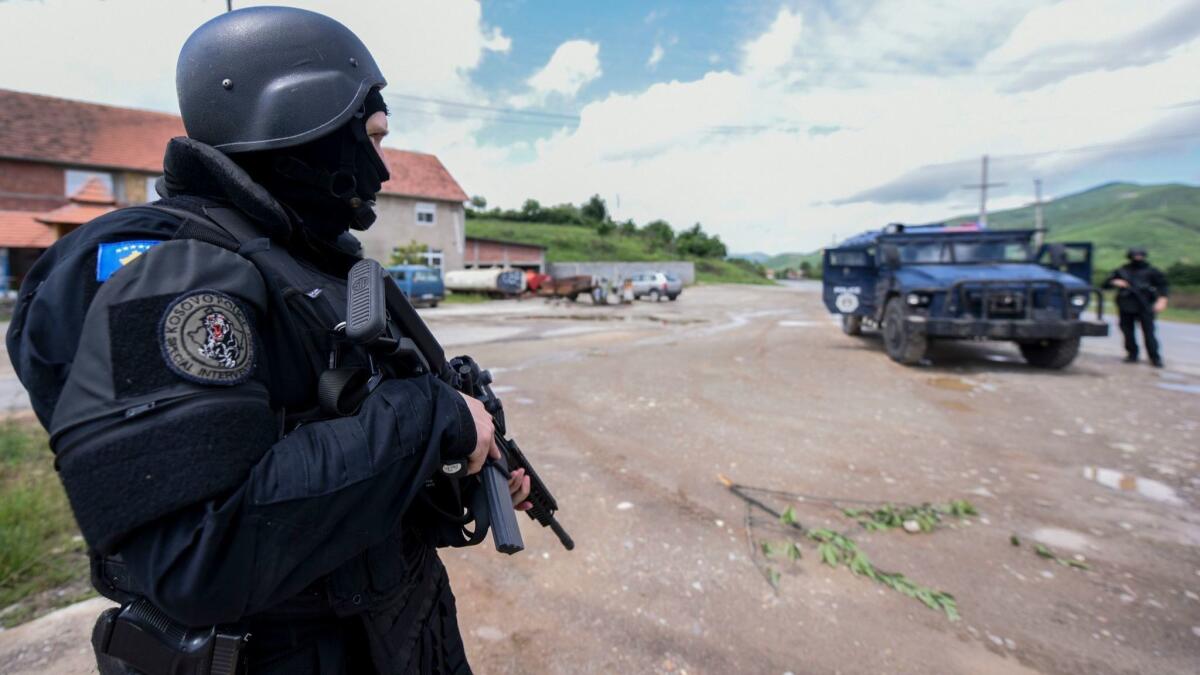 Kosovo special police secure the area during an anti-smuggling operation near the village of Cabra in Serb-dominated northern Kosovo on May 28. Two police officers were wounded as local Serbs resisted the sweep, in which dozens of people were arrested.