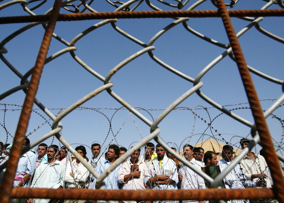 Iraqi prisoners wait to be released at Abu Ghraib in 2006.