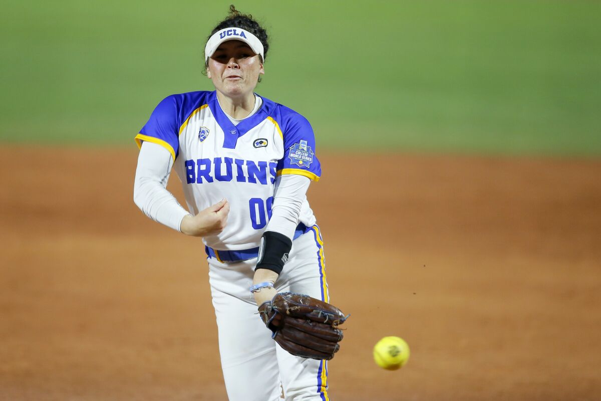 UCLA's Rachel Garcia pitches to a Florida State batter during an NCAA Women's College World Series softball game in Oklahoma City, Thursday, June 3, 2021. (Bryan Terry/The Oklahoman via AP)