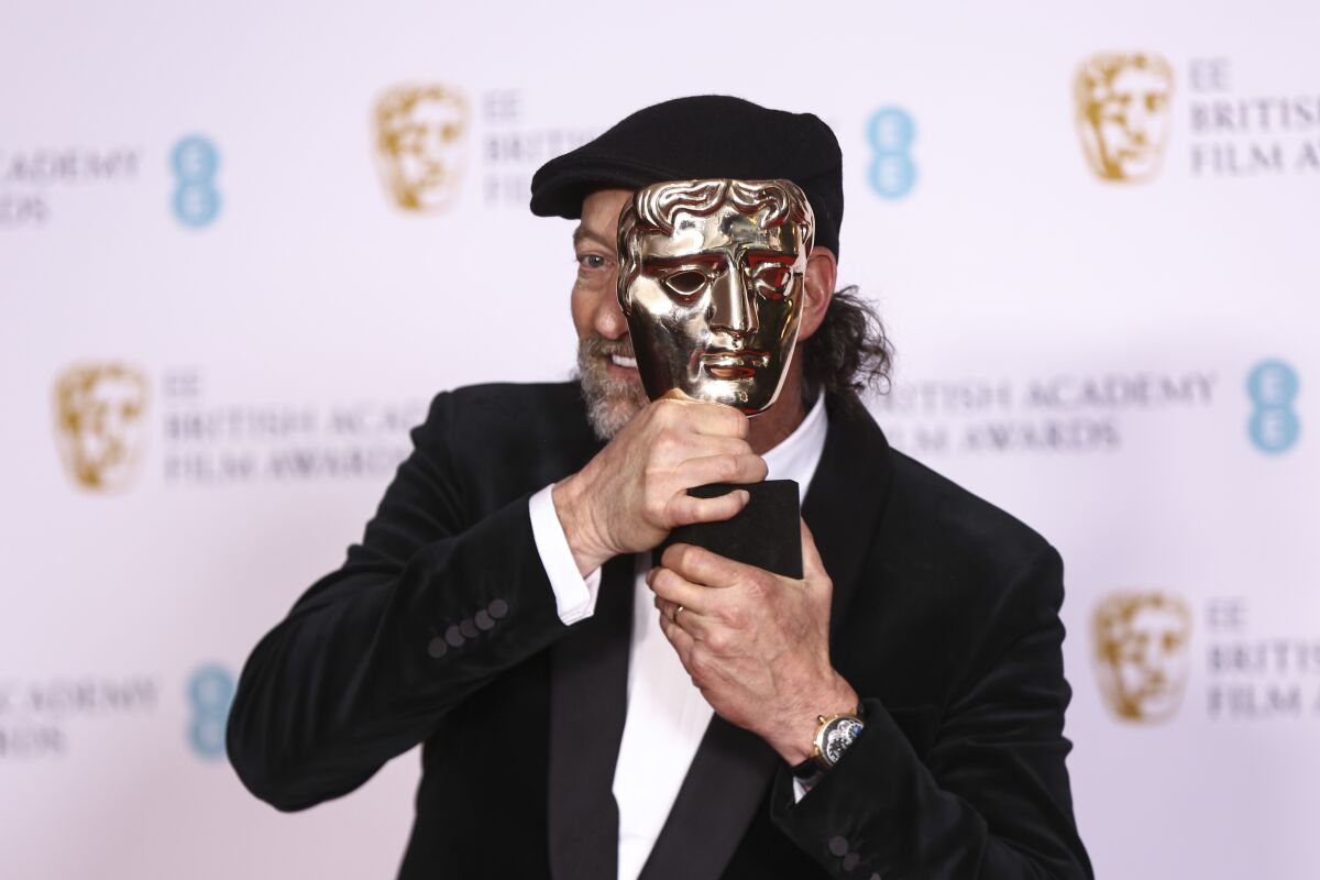 Troy Kotsur holds his Supporting Actor award for his role in the film 'Coda' at the 75th British Academy Film Awards, BAFTA's, in London Sunday, March 13, 2022. (Photo by Joel C Ryan/Invision/AP)
