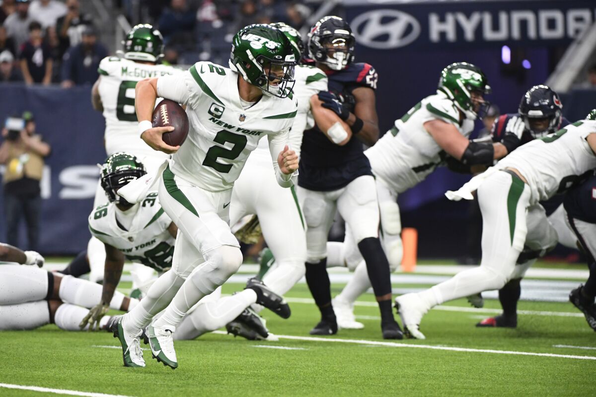 New York Jets quarterback Zach Wilson (2) carries for a touchdown in the second half of an NFL football game against the Houston Texans in Houston, Sunday, Nov. 28, 2021. (AP Photo/Justin Rex)