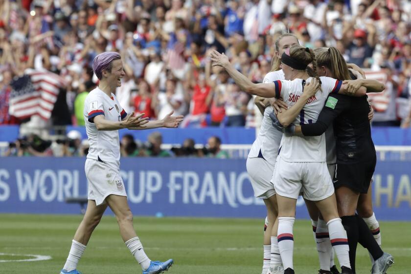 U.S. forward Megan Rapinoe, left, joins teammates in celebration after defeating the Netherlands in the Women's World Cup final on Sunday in Lyon, France.
