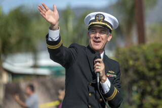 SAN FERNANDO, CA-NOVEMBER 11, 2022: Los Angeles Mayor Eric Garcetti waves to people in the crowd while participating in the 19th annual San Fernando Valley Veterans Day Parade on Laurel Canyon Blvd in San Fernando. A new mayor will be sworn in on December 12, 2022. (Mel Melcon / Los Angeles Times)