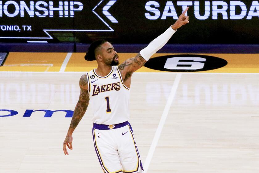 Lakers guard D'Angelo Russell gives the No. 1 sign after making a shot against the Warriors in Game 3 on Saturday night.
